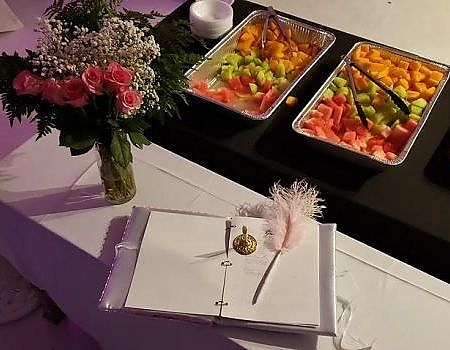 Food and sign in book at Mexican pary at Gray's Event Center.